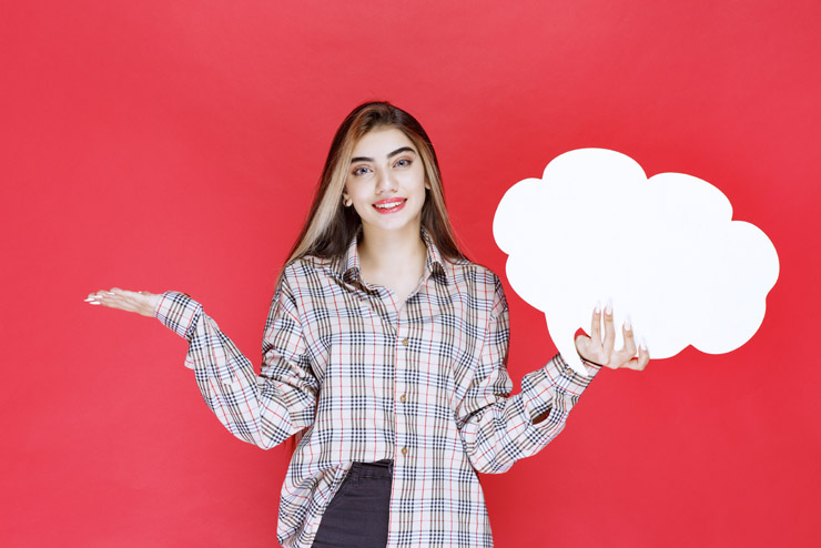 Woman holding a speech bubble