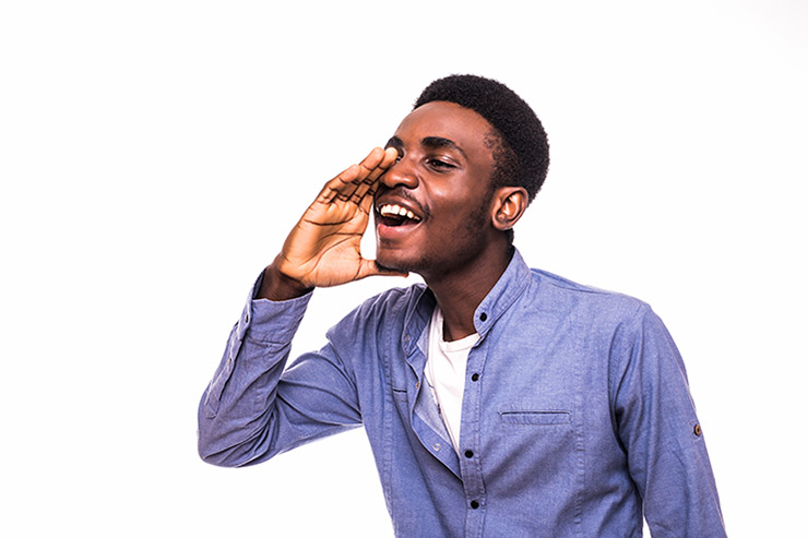 Young african man screaming out loud isolated on white background