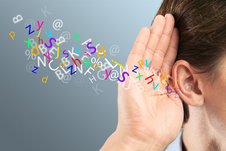 Businessman holds his hand near his ear and listening something